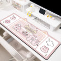 Natural rubber oversized desk pad showing pink bunny, purple bear, and purple kitten colour options