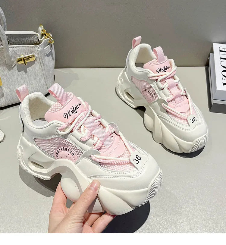 Women's beige platform sneakers with crossover ankle straps and a thick rubber sole.