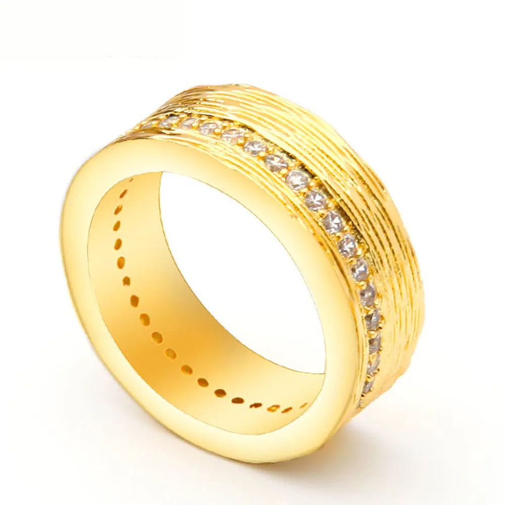 Gold geometric zircon ring for women on a copper base, showing angular design.