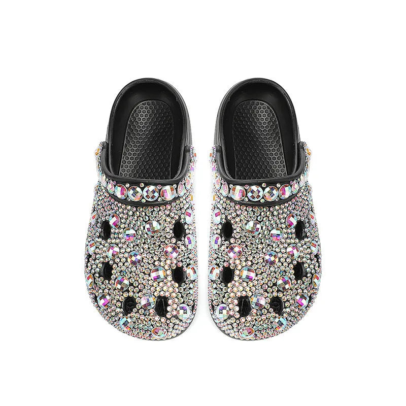 Black women's platform sandals with rhinestone decoration and hole shoe design on an EVA sole.