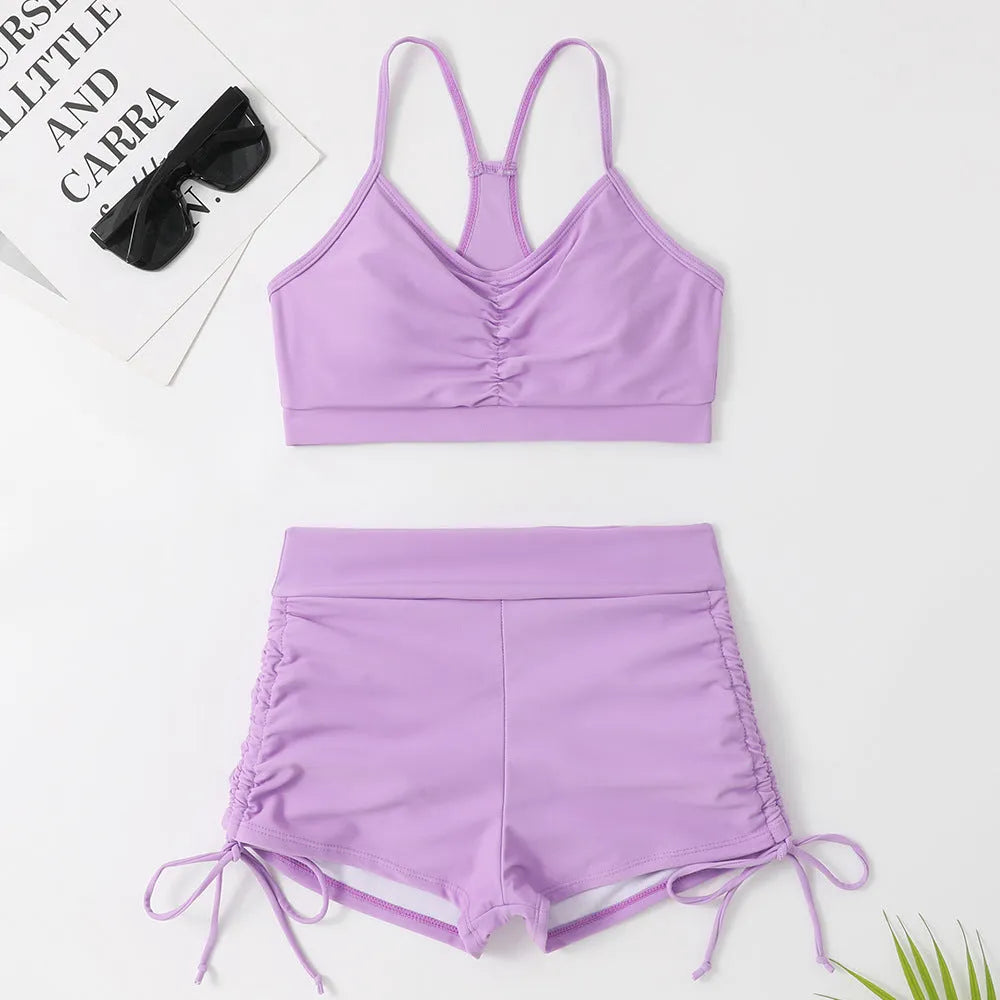 Women's purple high-waist split swimsuit bikini set with sleeveless top and matching briefs