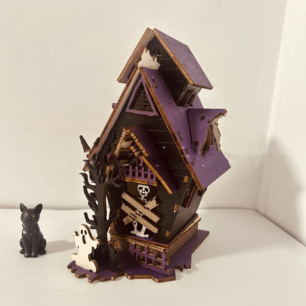DIY wooden glowing haunted house Halloween decoration with candlestick holder, shown at 14x10.5x19cm size.