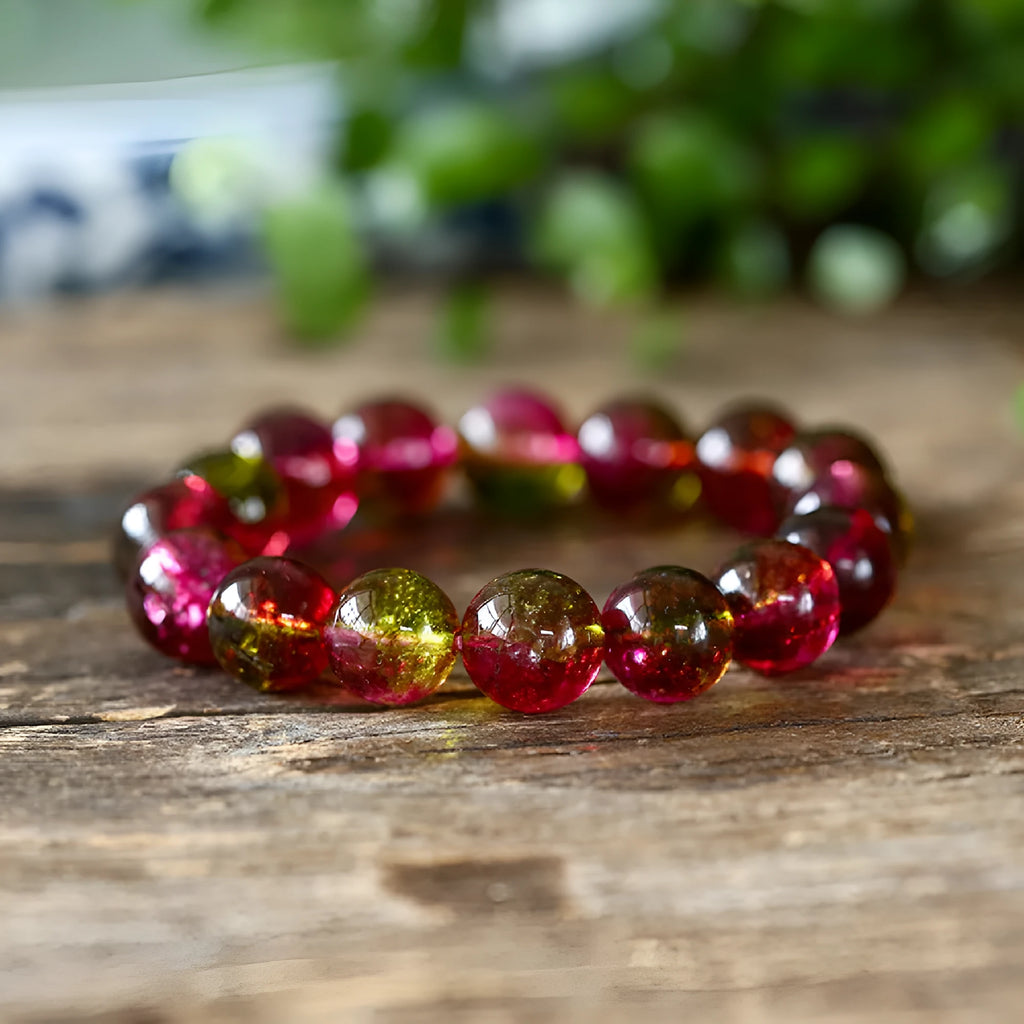 Handmade watermelon crystal bracelet for women on a wrist, showing pastoral design details.