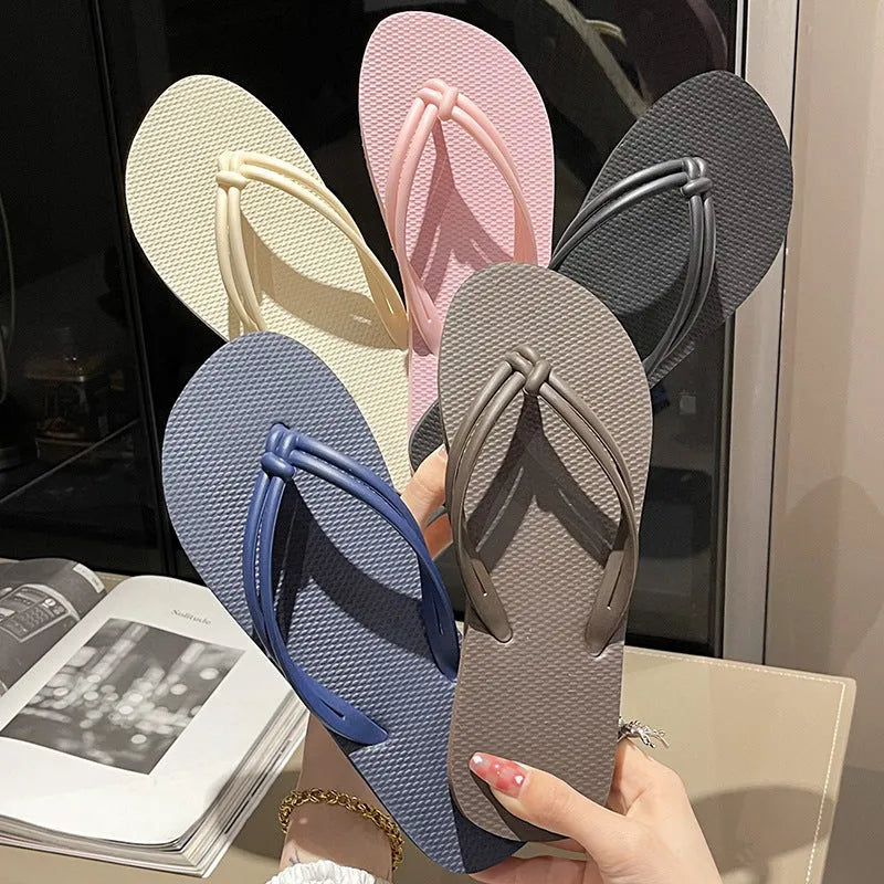 Men's PVC toe-covering flip flops in beige colour on a plain background.