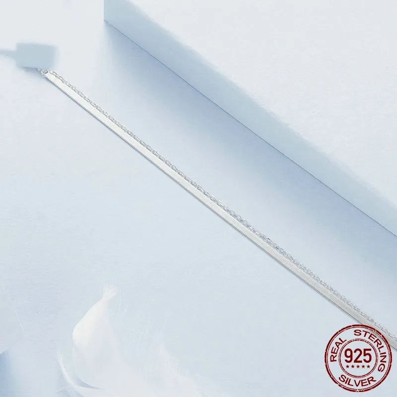 S925 sterling silver double-layer bracelet with electroplated finish, BSB193 colour, on female wrist against neutral background
