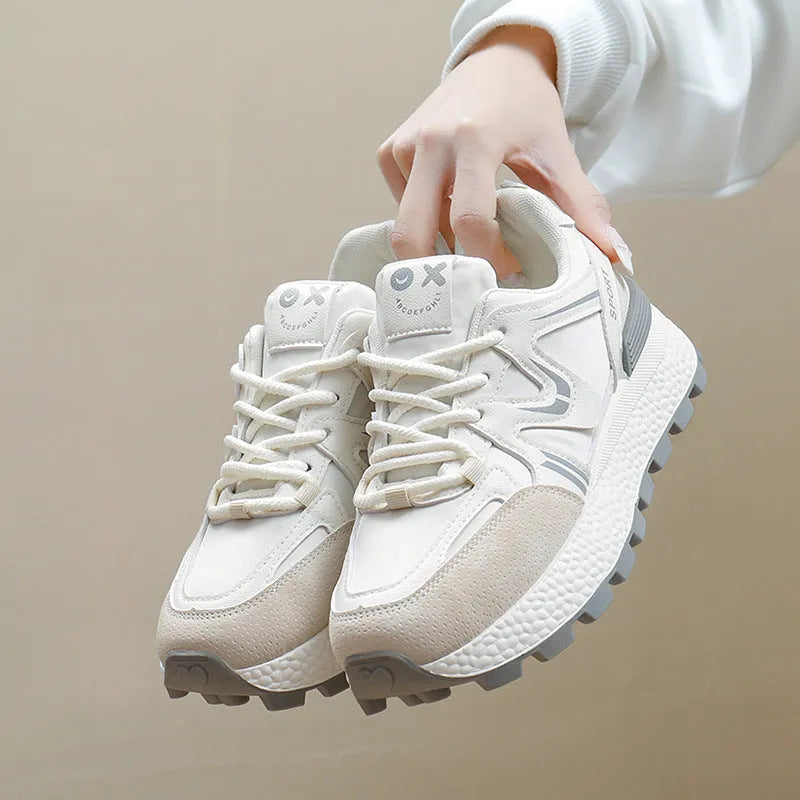 Women's black platform casual shoes with flat heel, round toe, and lace-up front on a white background.