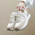 Women's black platform casual shoes with flat heel, round toe, and lace-up front on a white background.