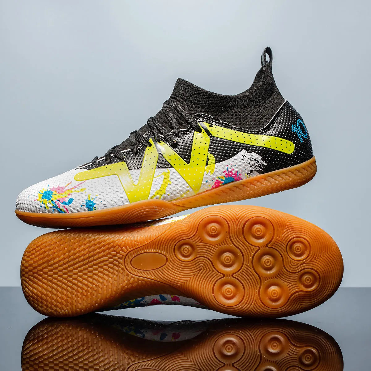 Low-top adult football boots with replaceable studs in Black & Yellow, White Black, and White Powder colour options.