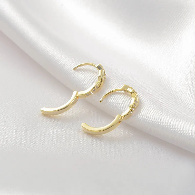 Geometric interwoven hemp rope earclip earrings in gold and silver colours with diamond-cut copper finish