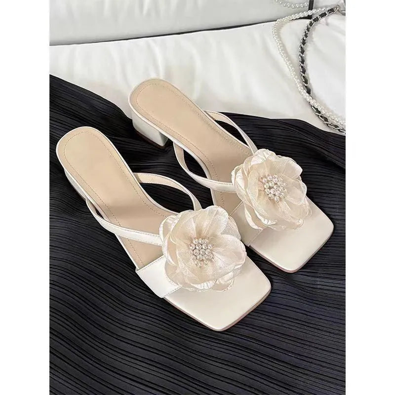 Women's cream white chunky heel sandals with square toe and single satin strap on a rubber sole.