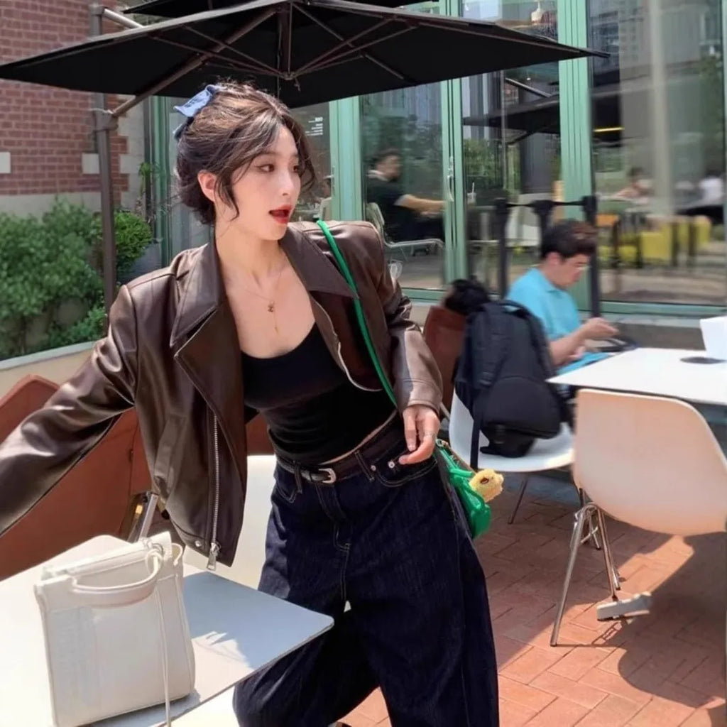 Women's slim fit imitation leather jacket in black with 40cm length and street fashion styling