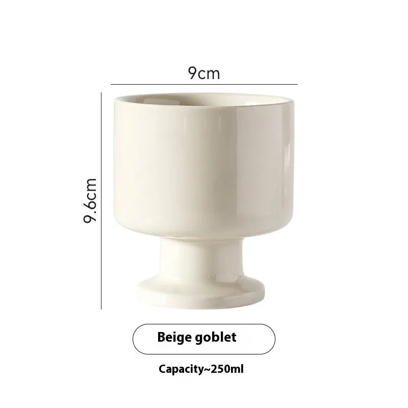 Hand-pinched irregular shaped ceramic mug in a solid colour, modern simple design