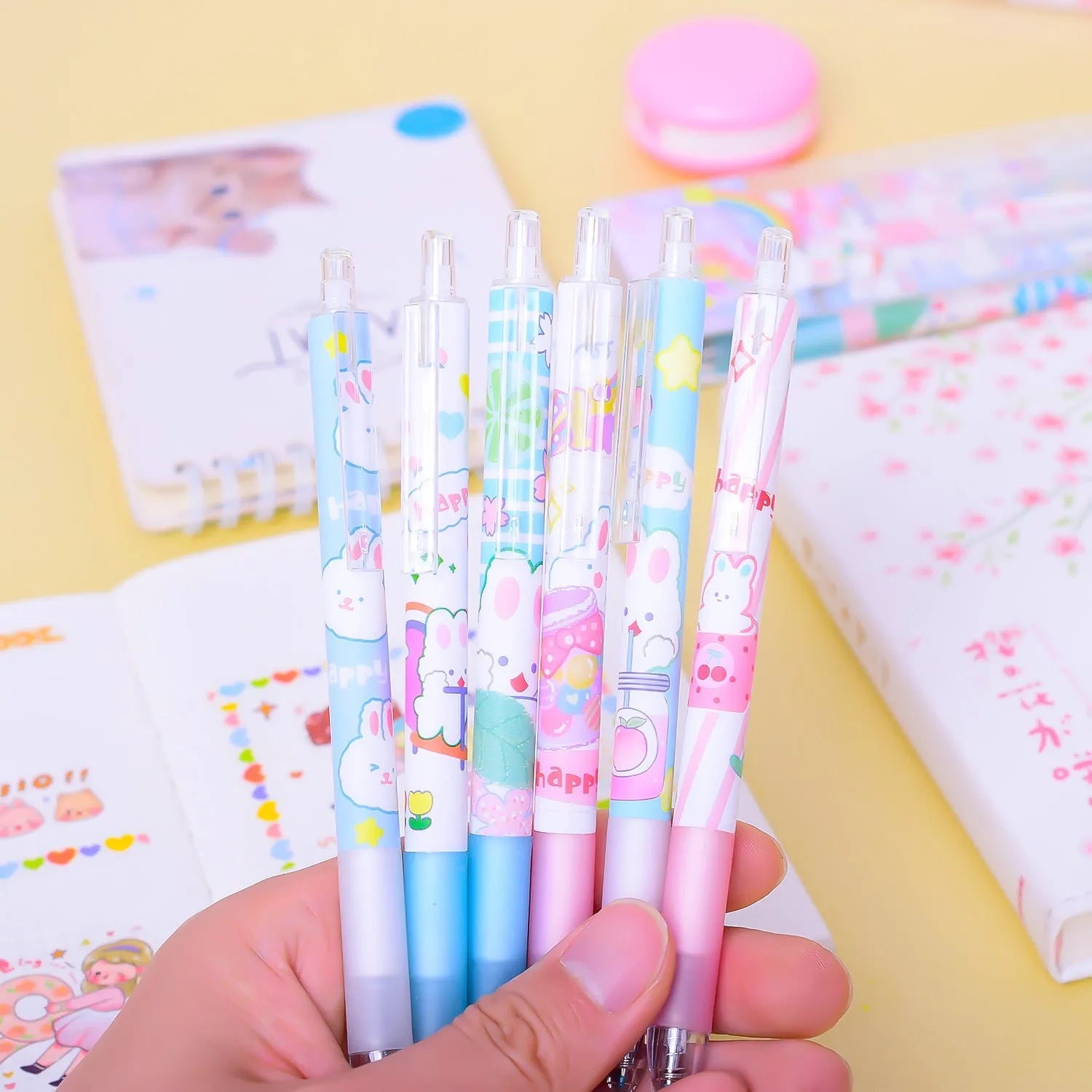 Six black ballpoint pens with cartoon bunny design and 0.5mm tips in packaging
