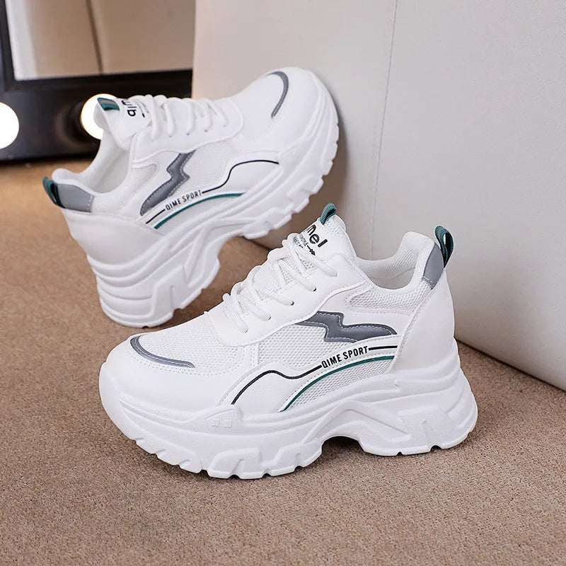White women's low-top dad shoes with cross shoulder straps and a front lace-up closure.