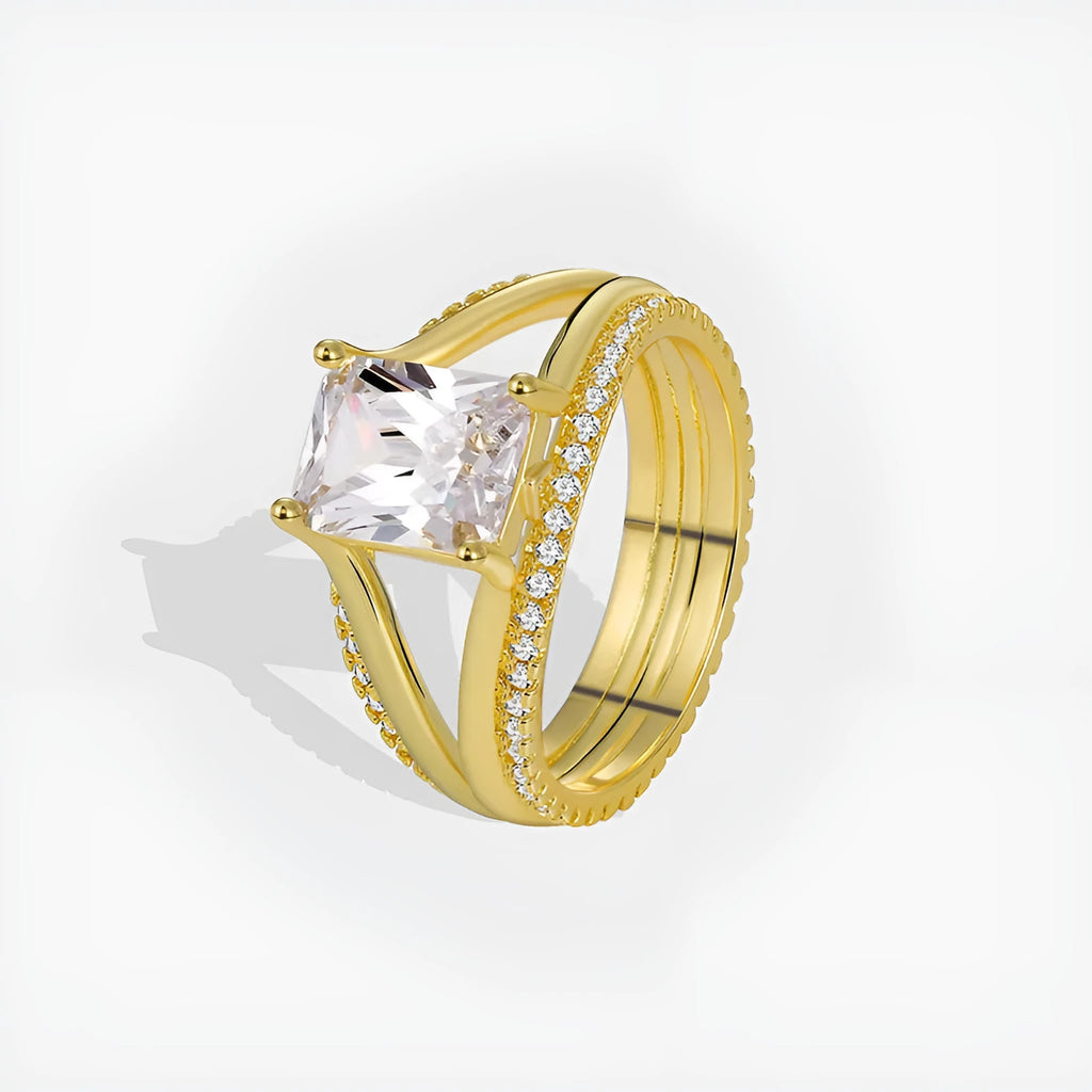 Gold electroplated copper ring with square zircon stone in geometric design, showing side profile