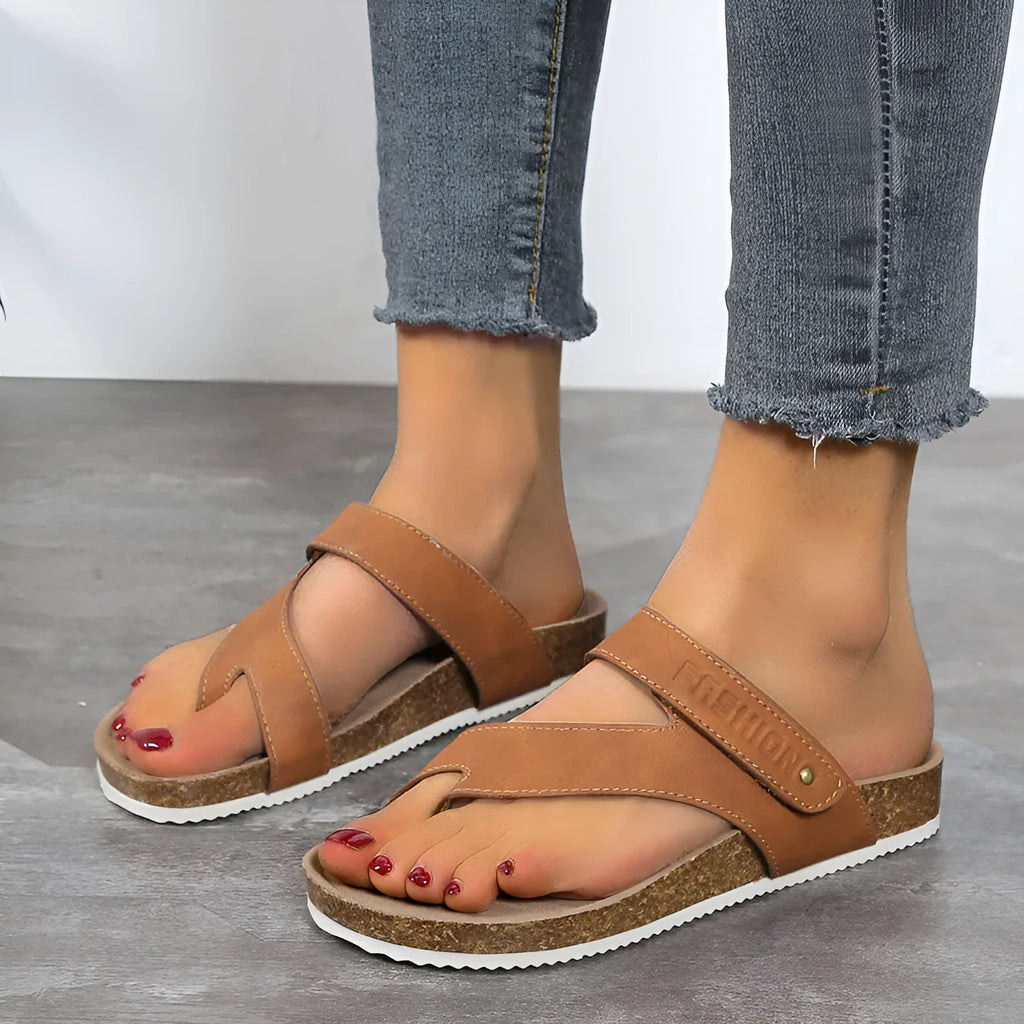 Blue flat toe ring flip-flops with a thick foam sole on a solid background.
