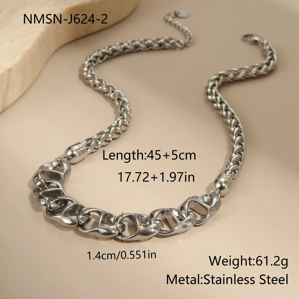 Stainless steel geometric pendant necklace with gold plating on a regular chain.
