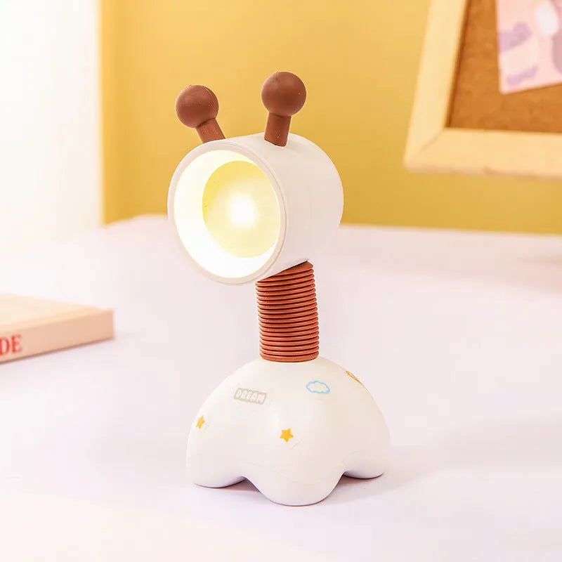 DIY magnetic cartoon small night lamp with multi-angle adjustable lighting on desktop