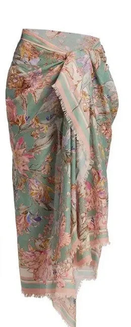 Creamy-white floral patterned women's three-piece bikini set with skirt.