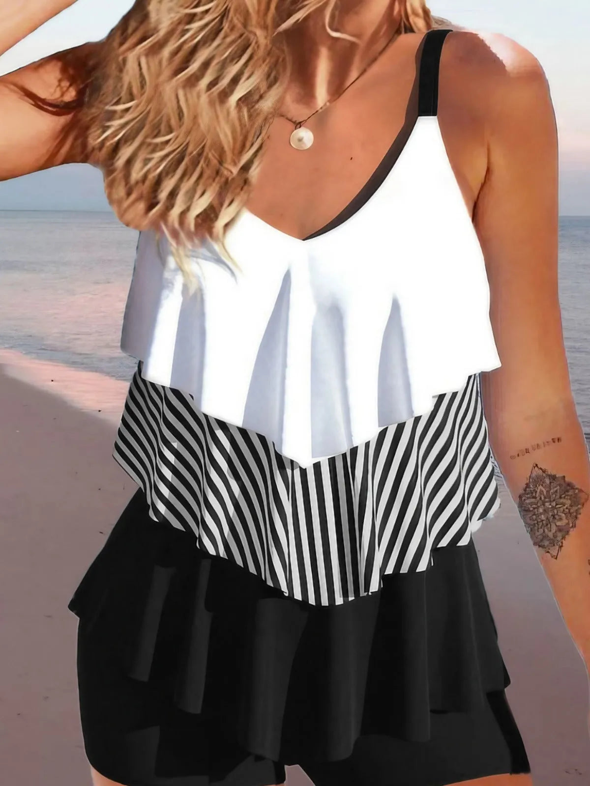Women's sleeveless backless spaghetti-strap bikini with ruffle detail in various colours and patterns