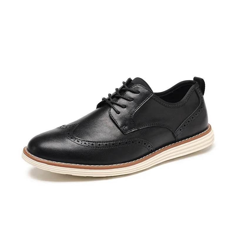 Men's black and brown slip-on casual shoes with round toe and carved detail on the upper.