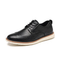 Men's black and brown slip-on casual shoes with round toe and carved detail on the upper.