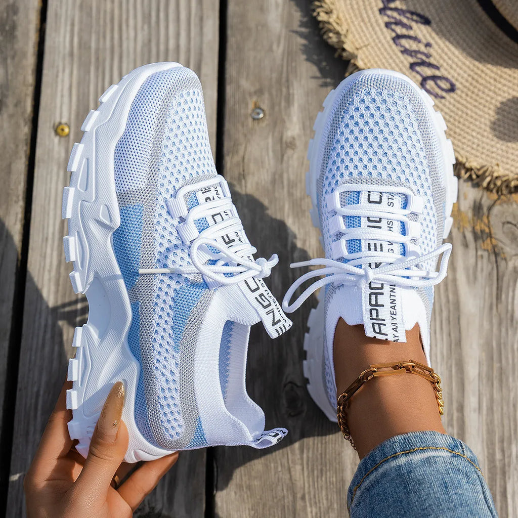 Women's Flyknit mesh lace-up sneakers in multiple colours with low flat rubber sole.