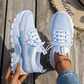 Women's Flyknit mesh lace-up sneakers in multiple colours with low flat rubber sole.