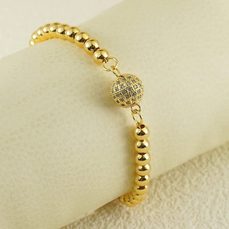 Women's copper bracelet with zircon Arabic styling and heart-shaped pendant on wrist