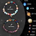 Two adjustable natural stone beaded bracelets with silver zodiac charms on a flat surface.