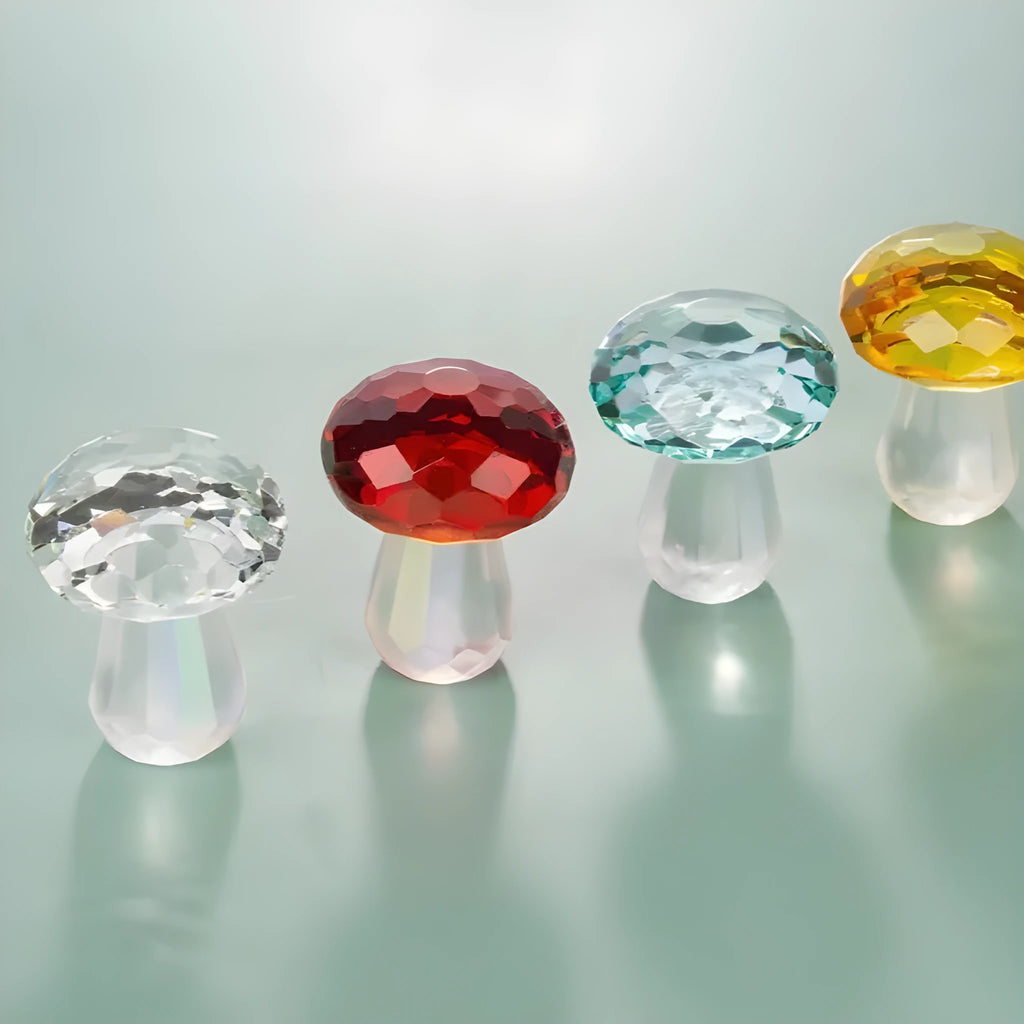 Colourful geometric crystal mushroom decoration in transparent, green, red, or yellow on a white background.