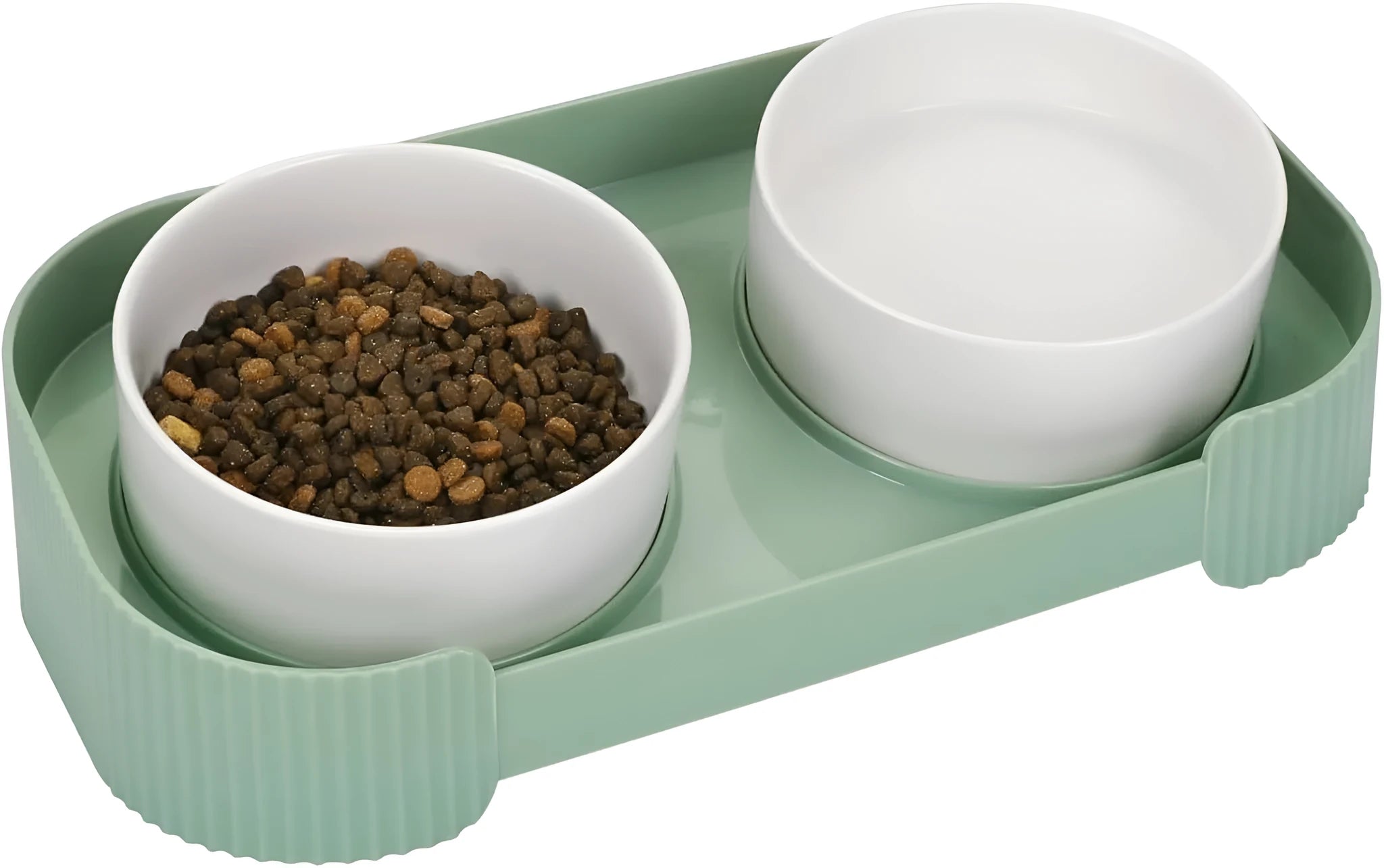 Green and white ceramic elevated cat bowls on a tilted stand for food and water.