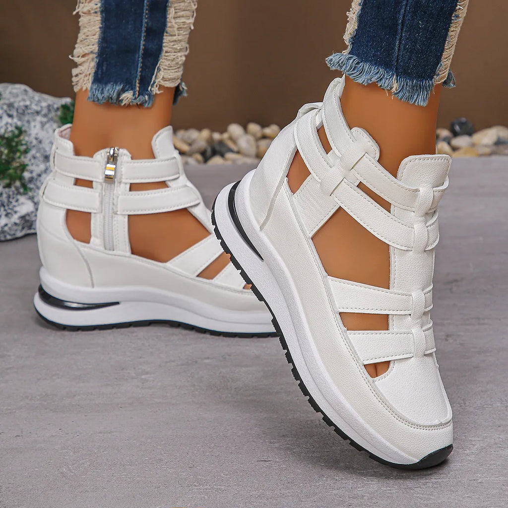 Women's black hollow-out platform sandals with Velcro fastening on a white background