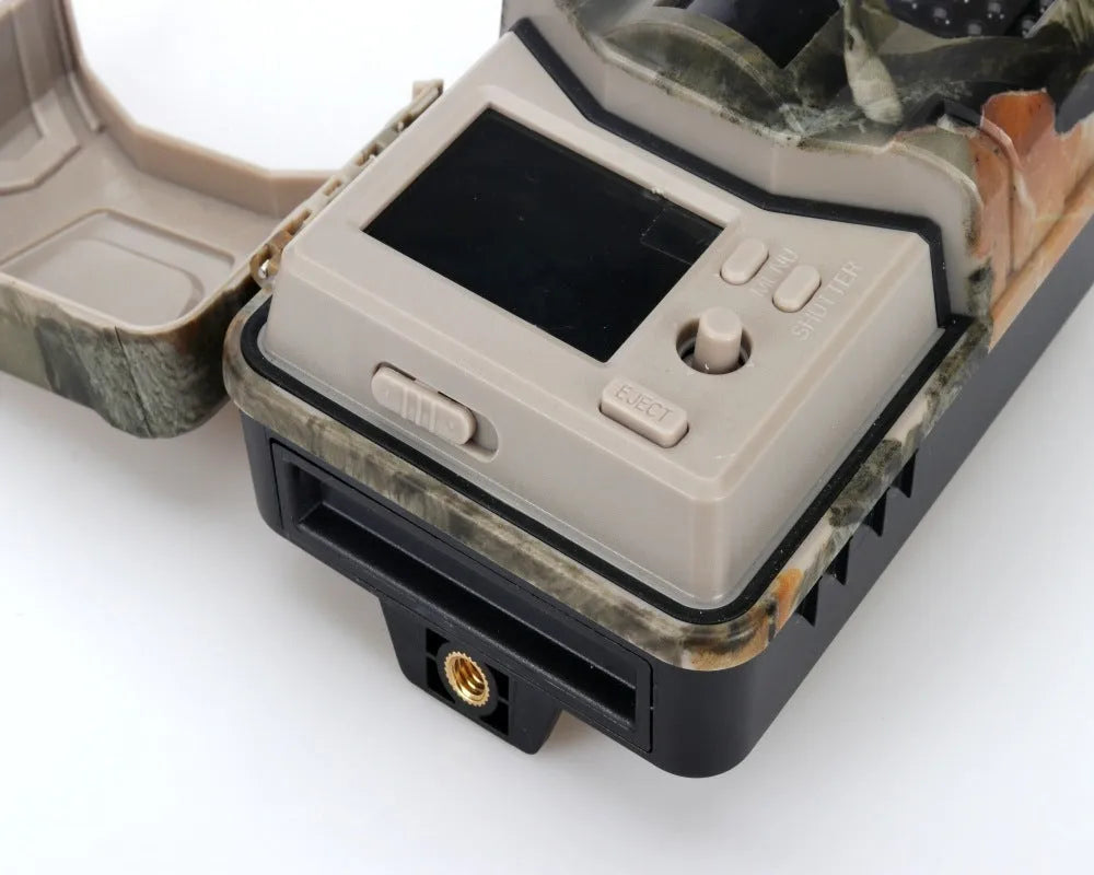 Compact camouflage outdoor Bluetooth hunting camera with infrared LEDs for night vision.
