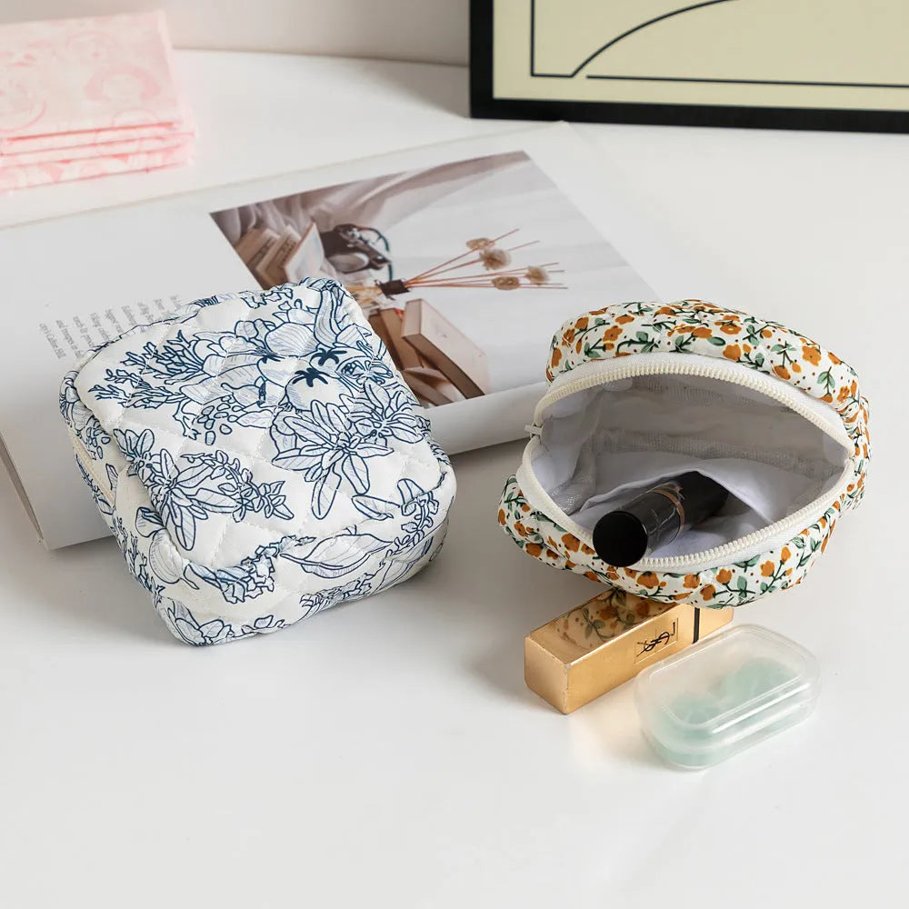 Floral pattern key storage bag made from breathable polyester fabric in various colour options.