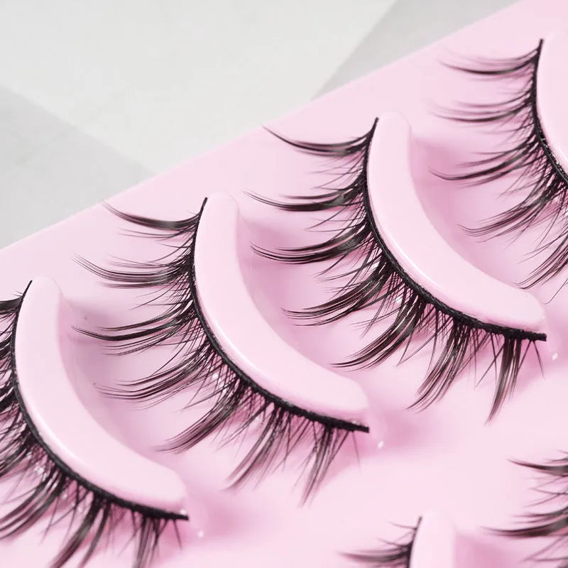 Pack of 5 pairs of black manga-style false eyelashes with natural wispy length on a white background.