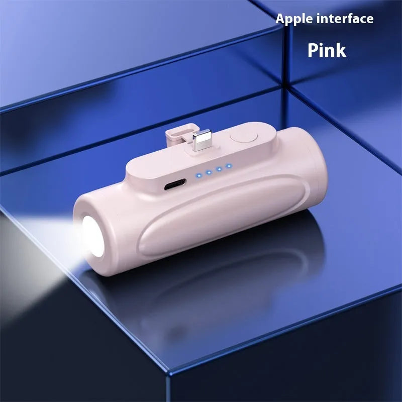 Black and pink portable power bank with integrated LED flashlight, showing Type-C and Apple port options.
