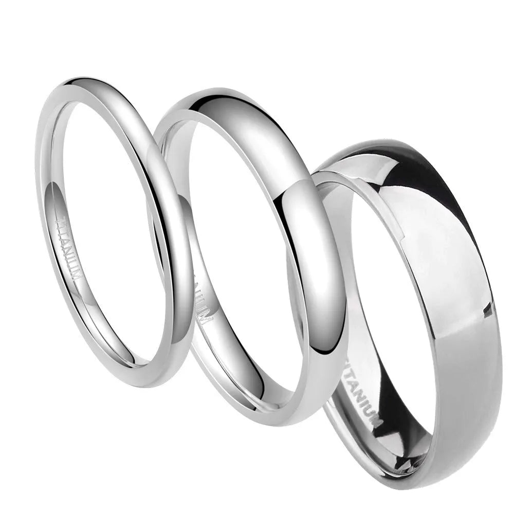 Silver titanium steel band ring shown in different widths on a hand.