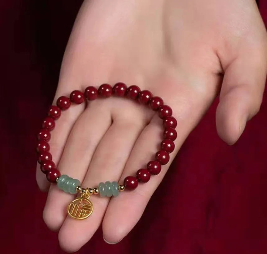 Close-up of a handcrafted wave-shaped cinnabar and copper bead bracelet in national style.