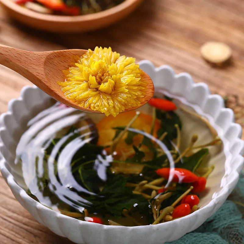 Box of Honeysuckle Chrysanthemum Tea sachets with a free tea cup, showing bulk packaging options.