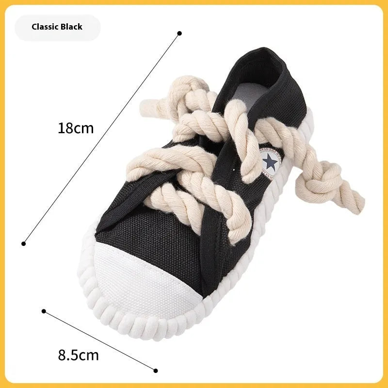 A bendable plastic dog slippers squeaker toy in yellow, black, or blue for chewing and play.