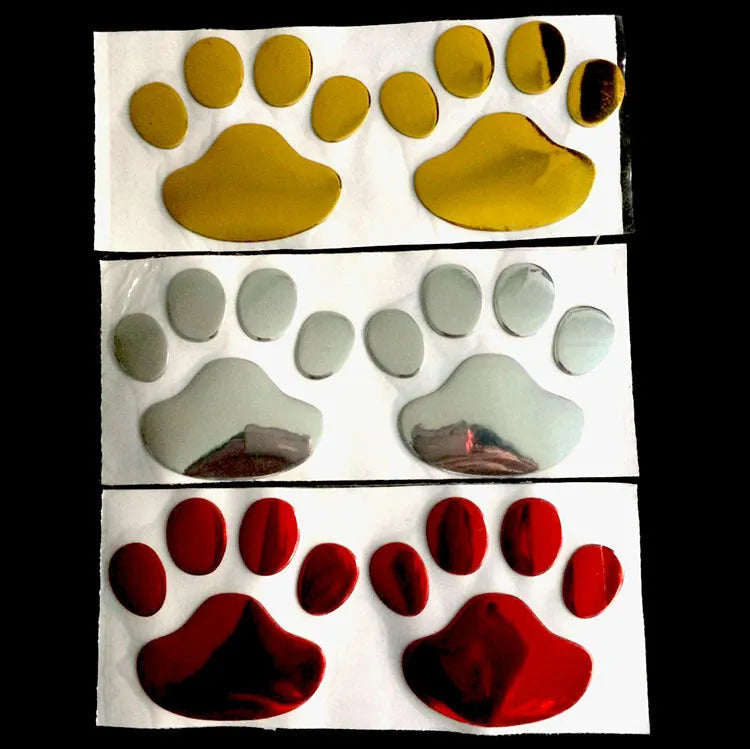 PVC car sticker with hand-shaped brush dog footprints design on a car bumper.