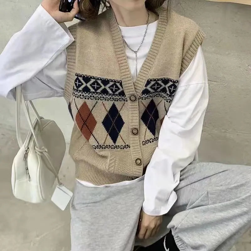 Woman wearing a sleeveless loose-fit cardigan top with a diamond plaid pattern in khaki.