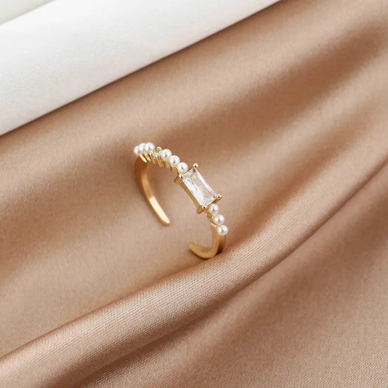 Women's gold-toned square alloy ring with diamond-cut surface and inlaid artificial gemstone on adjustable band