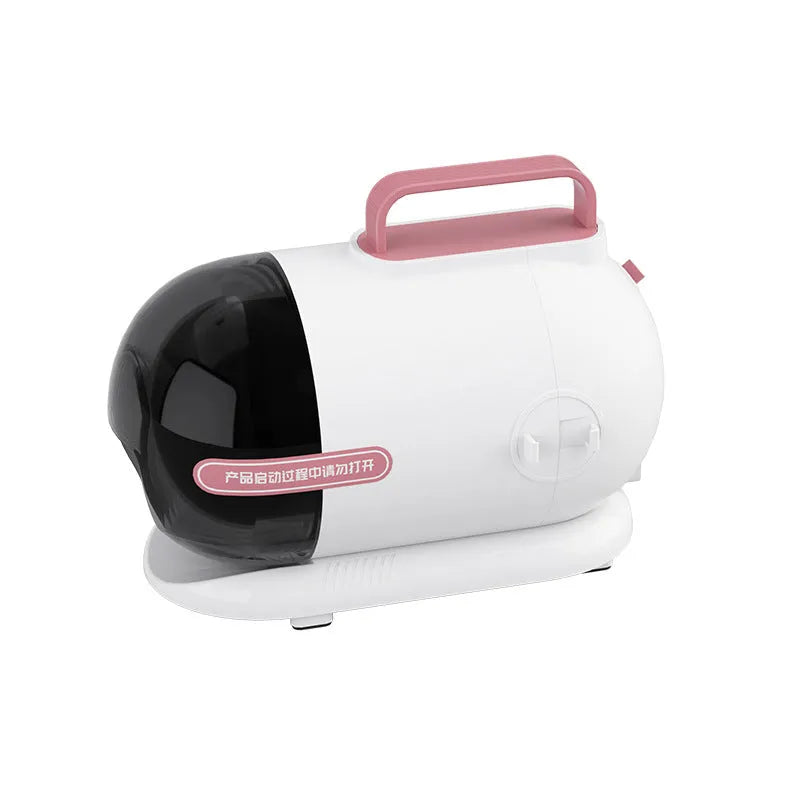Pink and white pet grooming vacuum cleaner host with attachments including electric shear and combs.
