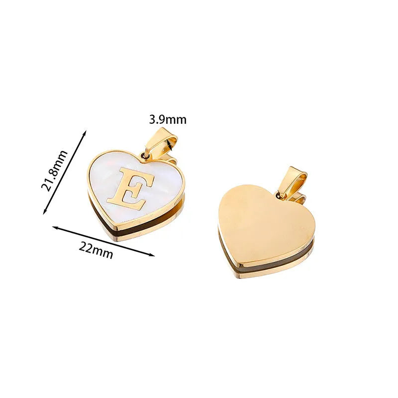 Gold-plated heart necklace with white shell pendant showing initial engraving on stainless steel chain