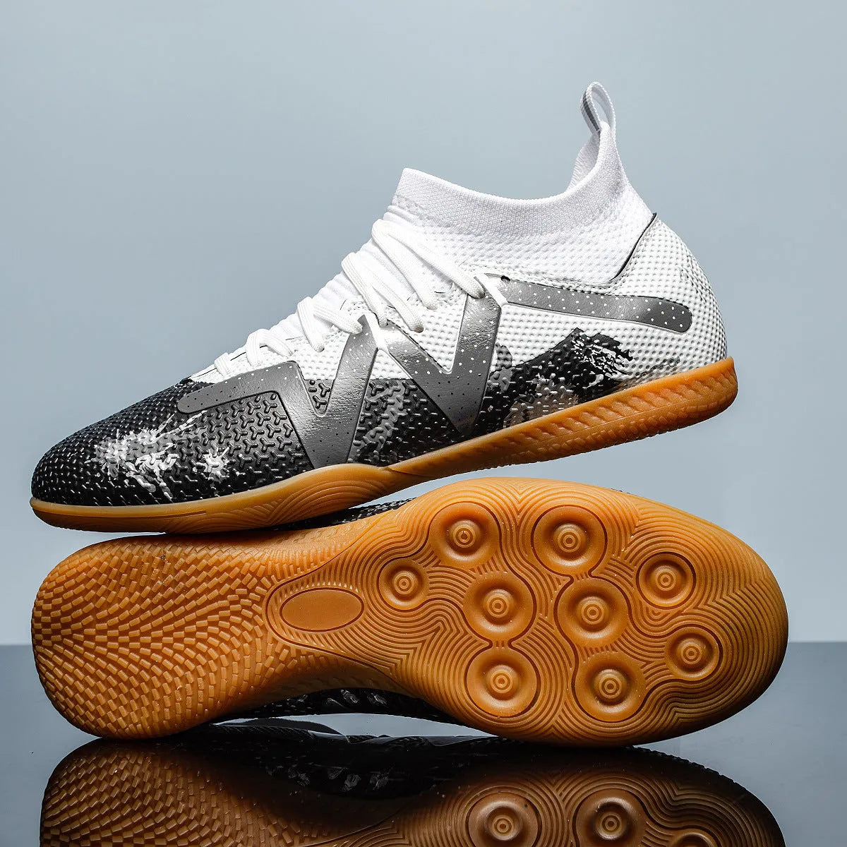 Low-top adult football boots with replaceable studs in Black & Yellow, White Black, and White Powder colour options.