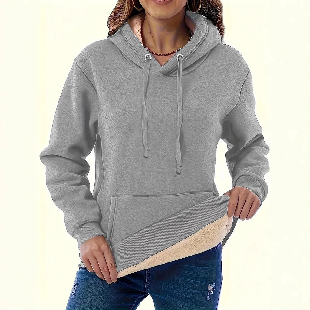 Women's loose black hooded sweater with pockets and a textured 3D pattern