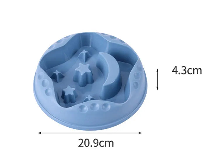 Blue slow feeder dog bowl with moon and star wing design and internal maze pattern.