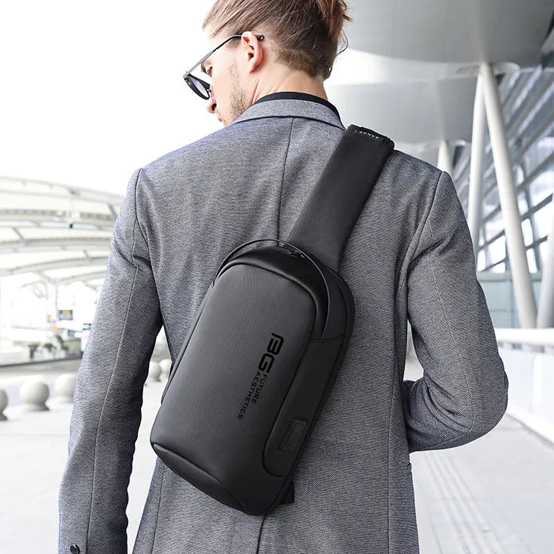 Men's blue Oxford cloth shoulder bag with a USB charging port on the front.